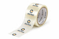 A roll of clear tape with a printed white strip unspooling, featuring the JGUS PACK logo in blue and orange on a clean white background.