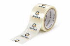 A roll of clear tape with a printed white strip unspooling, featuring the JGUS PACK logo in blue and orange on a clean white background.