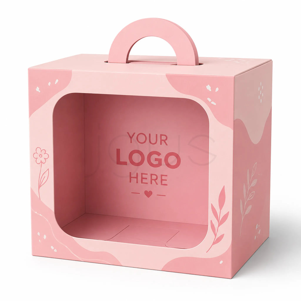 A pink cardboard gift box with a built-in carrying handle and a large die-cut window on the front. The box has decorative pink abstract shapes, floral line drawings, and placeholder text inside reading 'YOUR LOGO HERE' on a white background.