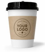 A white paper coffee cup with a black lid and a brown kraft paper sleeve printed with the placeholder text 'YOUR LOGO COFFEE CUP'.