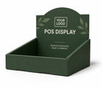 A dark green cardboard retail display stand with a hinged back panel, shown on a clean white background. The display features placeholder text reading 'YOUR LOGO' and 'POS DISPLAY' along with decorative leaf illustrations.