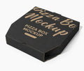 A black cardboard pizza box mockup with gold foil-style lettering that reads 'Pizza Box Mockup' and 'Pizza Box Mockup' on a clean white background.