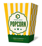 A yellow and white striped popcorn bucket with a green and white checkered side panel and a central label that reads 'YOUR LOGO POPCORN' and 'FRESH & CRUNCHY' on a white background.
