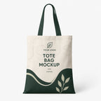 A canvas tote bag mockup on a light gray background, featuring a cream upper section with dark green text reading 'YOUR LOGO' and 'TOTE BAG MOCKUP', plus a dark green lower section with a leaf motif.