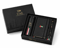 A luxury black gift set for the UAE, featuring a matching black presentation box with gold lettering and a black travel tumbler, notebook, pen, and ring set inside, decorated with the UAE flag colors.